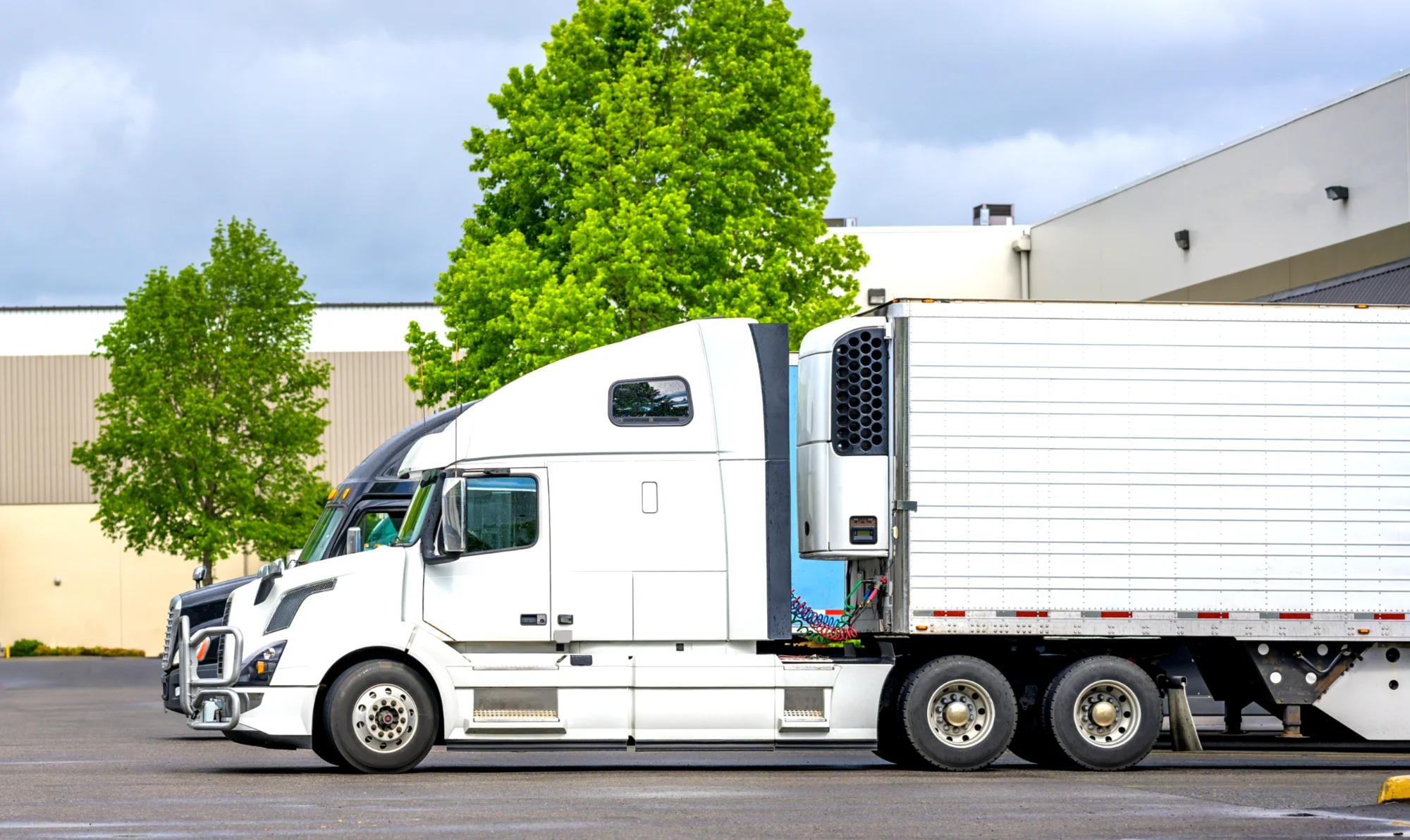 Refrigerated trailer at warehouse dock receiving sponsored load